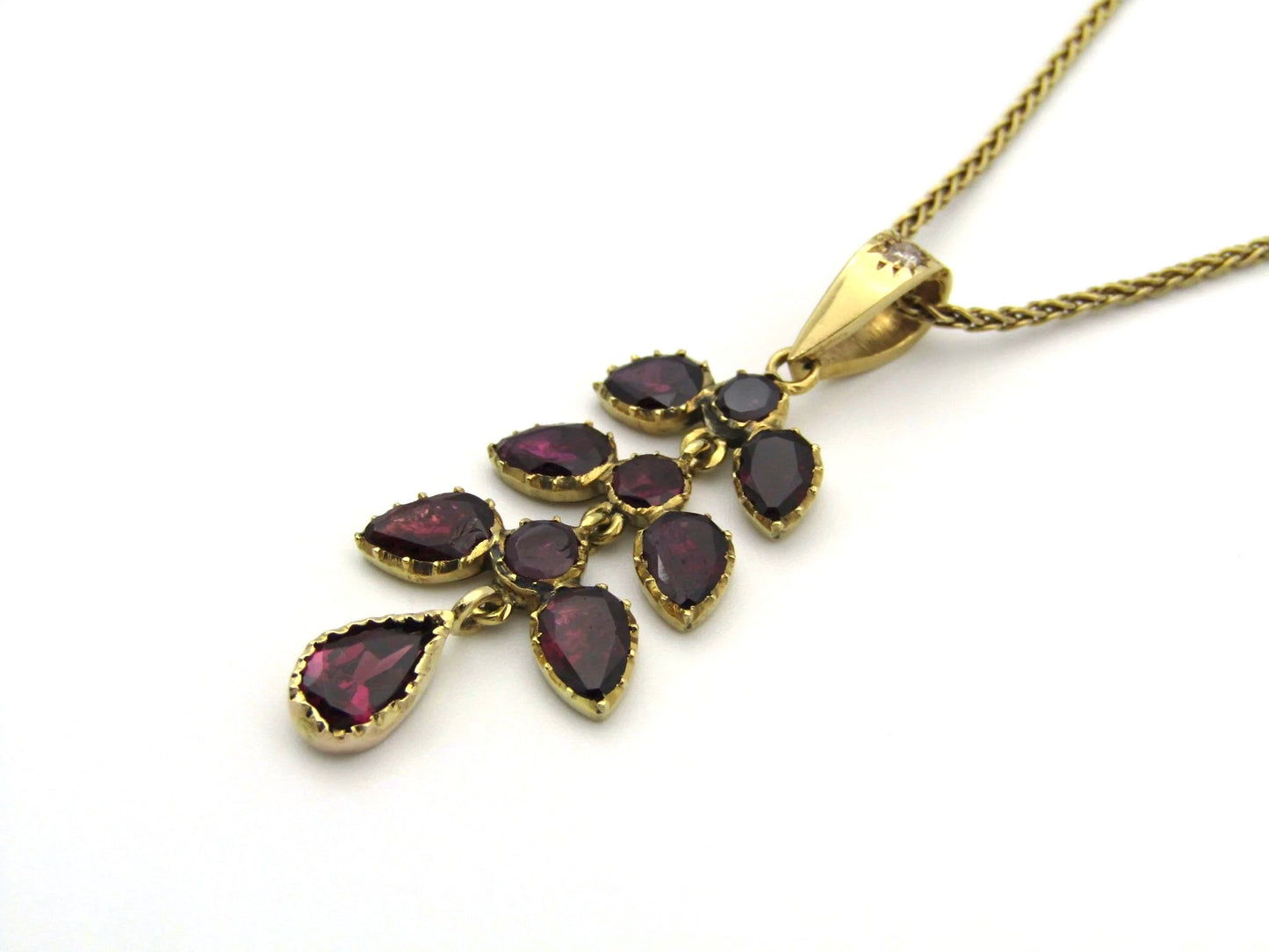A Vintage 9K gold Almandine garnet and diamond pendant.