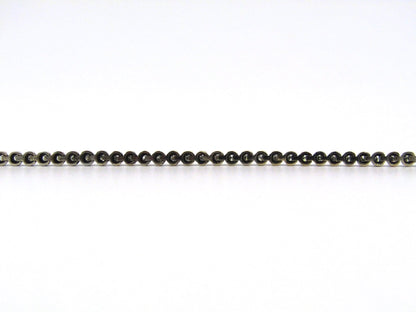 14K gold diamond tennis bracelet.