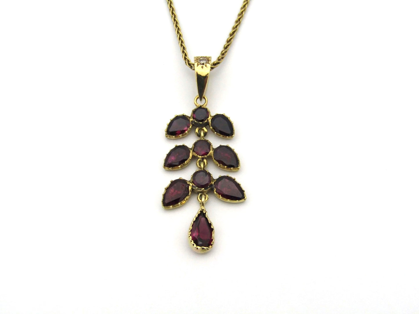 A Vintage 9K gold Almandine garnet and diamond pendant.