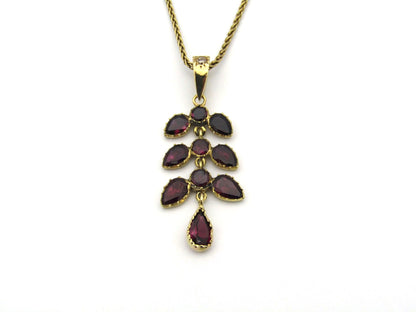 A Vintage 9K gold Almandine garnet and diamond pendant.